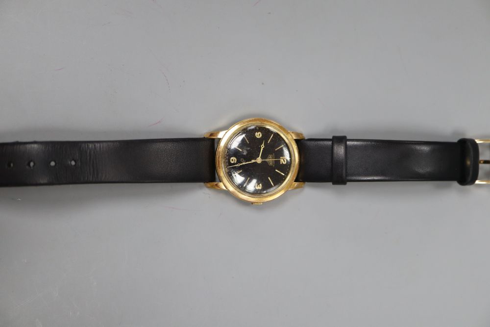 A 1960s? steel and gold plated Heuer black dial automatic wrist watch, on later associated strap.
